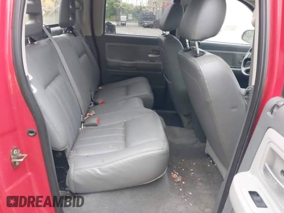 2005 Dodge Dakota Laramie with VIN 1D7HE58N05S224288, listed as a IAAI auction lot 42542056 with 218,774 mi miles and . Bid and sale history available at DreamBid. Image 8.