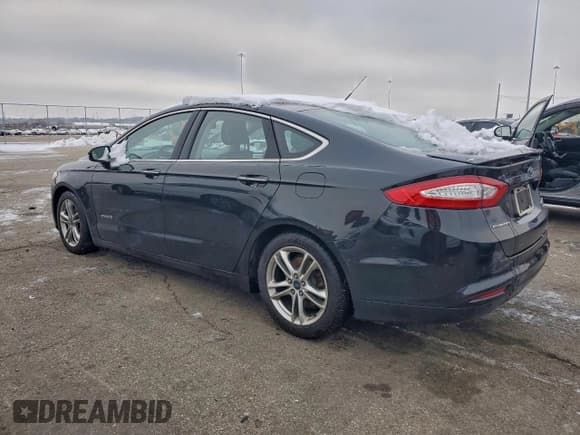 ✅ 2015 Ford Fusion Titanium Hybrid • VIN: 3FA6P0RU6FR179817 • Lot: 95251945. Wystawiony na Copart z przebiegiem 115 636 mil. Bezpłatny archiwum sprzedaży aukcyjnych z USA i szczegółowy raport historii pojazdu na DreamBid. Zdjęcie 2.