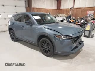 ✅ 2022 Mazda CX-5 S Carbon Edition • VIN: JM3KFBCM3N0612533 • Lot: 43432608. Listed on IAAI with 50,760 mi. Free auction sales archive from the USA and detailed vehicle history report at DreamBid. Image 1.