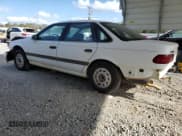 ✅ 1992 Ford Taurus GL • VIN: 1FALP52U5NA280821 • Lot: 77457304. Listed on Copart with 33,484 mi. Free auction sales archive from the USA and detailed vehicle history report at DreamBid. Image 2.