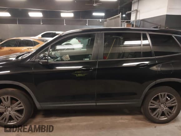 ✅ 2021 Honda Passport EX-L • VIN: 5FNYF8H54MB036555 • Lot: 42493765. Listed on IAAI with 61,454 mi. Free auction sales archive from the USA and detailed vehicle history report at DreamBid. Image 15.