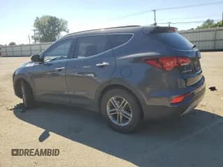 ✅ 2018 Hyundai Santa Fe 2.4L • VIN: 5XYZU3LB6JG522640 • Лот: 59038864. Опубликован ранее на Copart с пробегом 82 372 миль. Бесплатный доступ к архиву аукционных продаж из США и подробный отчёт об истории автомобиля на DreamBid. Изображение 2.