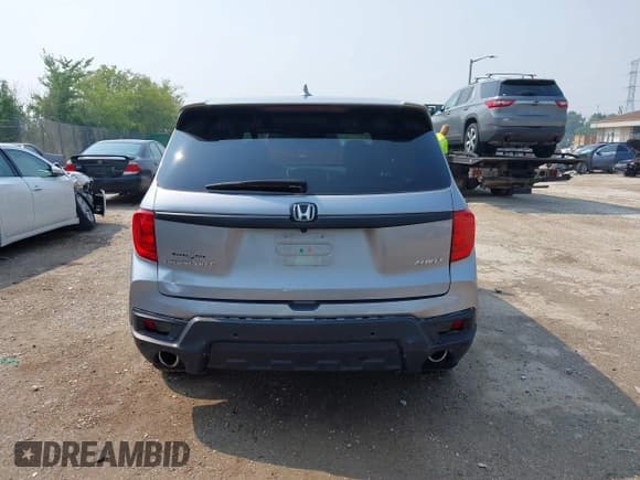 ✅ 2023 Honda Passport EX-L • VIN: 5FNYF8H50PB019594 • Lot: 42882366. Listed on IAAI with 26,120 mi. Free auction sales archive from the USA and detailed vehicle history report at DreamBid. Image 16.