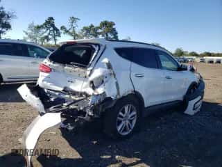 2014 Hyundai Santa Fe z VIN 5XYZUDLAXEG190334, wystawiony jako Copart lot #85566705 z przebiegiem 186 994 mil mil oraz Nie do naprawy • Non repairable. Historia ofert i sprzedaży dostępna na DreamBid. Obrazek 3.