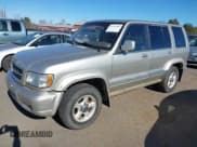 ✅ 1999 Isuzu Trooper S • VIN: JACDJ58X0X7927321 • Lot: 43713393. Listed on IAAI with 293,015 mi. Free auction sales archive from the USA and detailed vehicle history report at DreamBid. Image 2.