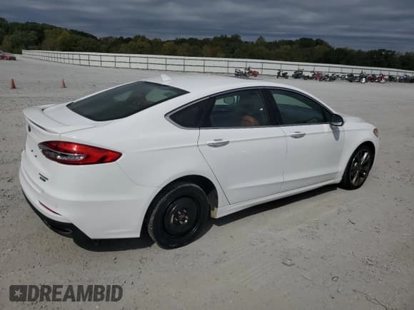 ✅ 2019 Ford Fusion Titanium • VIN: 3FA6P0D90KR152819 • Лот: 86274805. Опубликован ранее на Copart с пробегом 151 417 миль. Бесплатный доступ к архиву аукционных продаж из США и подробный отчёт об истории автомобиля на DreamBid. Изображение 3.