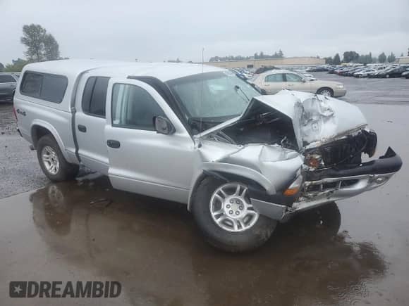 2003 Dodge Dakota Sport z VIN 1D7HG38N83S265442, wystawiony jako Copart lot #84969985 z przebiegiem Nie podano mil oraz Szkoda całkowita • Salvage title. Historia ofert i sprzedaży dostępna na DreamBid. Obrazek 4.