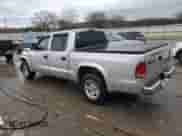 2002 Dodge Dakota SLT z VIN 1B7HL48X72S584617, wystawiony jako Copart lot #86504284 z przebiegiem 236 216 mil mil oraz Szkoda całkowita • Salvage title. Historia ofert i sprzedaży dostępna na DreamBid. Obrazek 2.