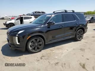 2023 Hyundai Palisade XRT с VIN KM8R34GE5PU586443, выставлен на аукционе Copart как лот 63532345 с пробегом 24 508 миль миль и Списание • Salvage title. История ставок и продаж доступна на DreamBid. Изображение 1.