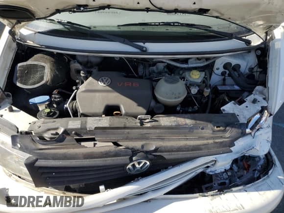 ✅ 1999 Volkswagen EuroVan GLS • VIN: WV2KH2705XH003038 • Lot: 61609125. Listed on Copart with 148,923 mi. Free auction sales archive from the USA and detailed vehicle history report at DreamBid. Image 12.