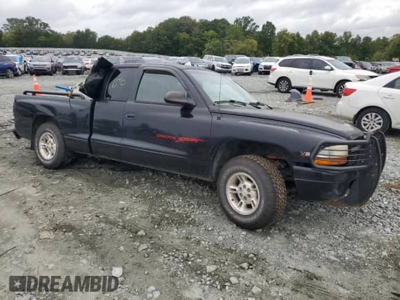 1998 Dodge Dakota SLT z VIN 1B7GL22YXWS651881, wystawiony jako Copart lot #73191384 z przebiegiem Nie podano mil oraz Szkoda całkowita • Salvage title. Historia ofert i sprzedaży dostępna na DreamBid. Obrazek 4.