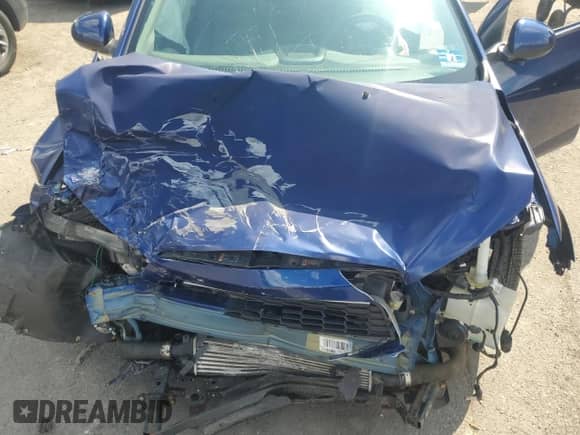 2012 Chevrolet Sonic LTZ z VIN 1G1JE5SB4C4213587, wystawiony jako Copart lot #63077975 z przebiegiem Nie podano mil oraz Szkoda całkowita • Salvage title. Historia ofert i sprzedaży dostępna na DreamBid. Obrazek 11.