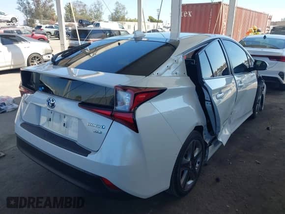 2021 Toyota Prius L Eco with VIN JTDKAMFU4M3134943, listed as a IAAI auction lot 43175713 with 106,611 mi miles and . Bid and sale history available at DreamBid. Image 4.