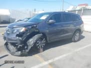 ✅ 2019 Honda Pilot EX-L • VIN: 5FNYF5H5XKB025457 • Lot: 42153274. Listed on IAAI with 71,956 mi. Free auction sales archive from the USA and detailed vehicle history report at DreamBid. Image 2.