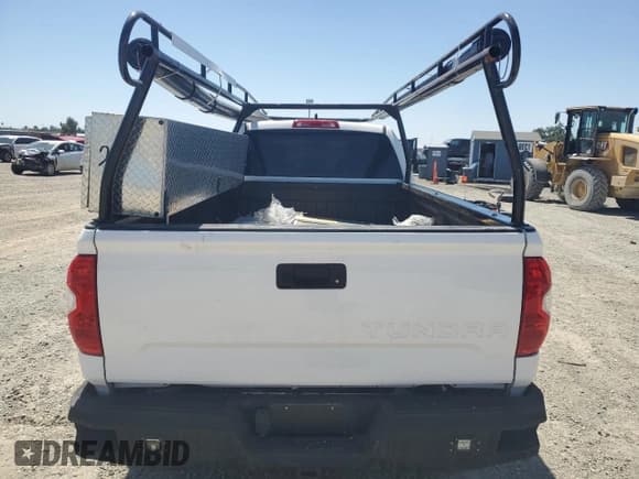 ✅ 2021 Toyota Tundra SR • VIN: 5TFTY5F19MX012163 • Lot: 55816455. Listed on Copart with 69,518 mi. Free auction sales archive from the USA and detailed vehicle history report at DreamBid. Image 6.