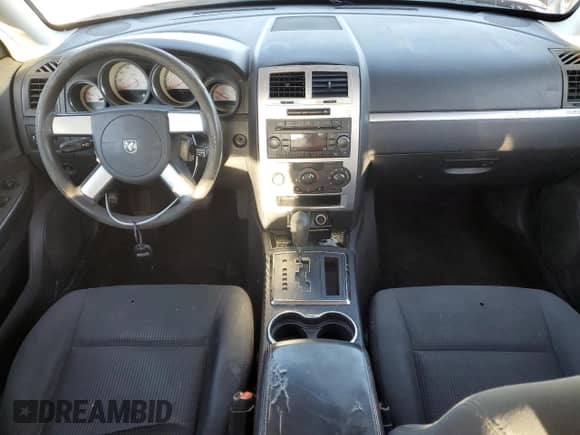 2010 Dodge Charger SXT with VIN 2B3CA3CV5AH178682, listed as a Copart auction lot 77254233 with 230,364 mi miles and Salvage title. Bid and sale history available at DreamBid. Image 8.