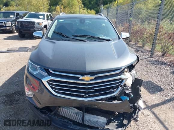 2018 Chevrolet Equinox Premier z VIN 3GNAXWEX1JS504549, wystawiony jako IAAI lot #43256484 z przebiegiem 64 262 mil mil oraz . Historia ofert i sprzedaży dostępna na DreamBid. Obrazek 12.