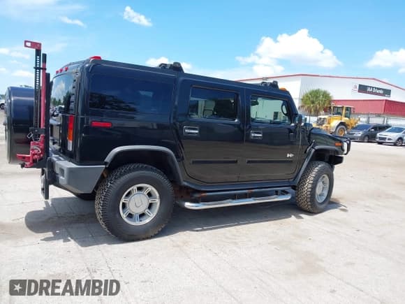 ✅ 2004 Hummer H2 • VIN: 5GRGN23U94H122582 • Lot: 42541864. Listed on IAAI with 105,764 mi. Free auction sales archive from the USA and detailed vehicle history report at DreamBid. Image 13.