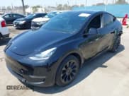 ✅ 2023 Tesla Model Y Long Range • VIN: 7SAYGDEE0PA023719 • Lot: 41974415. Listed on IAAI with 50,152 mi. Free auction sales archive from the USA and detailed vehicle history report at DreamBid. Image 2.