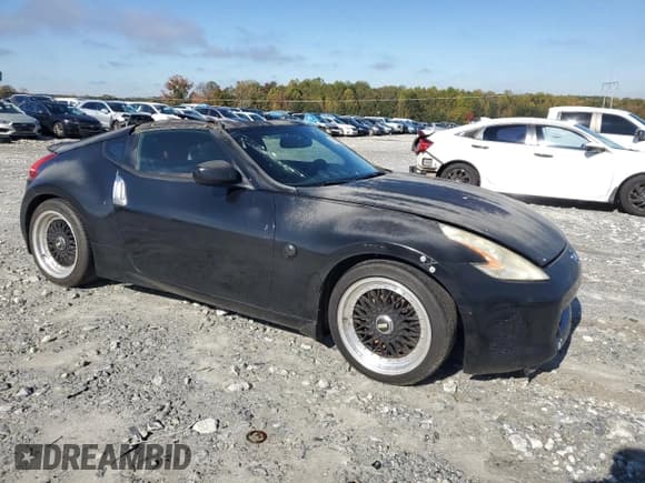 ✅ 2009 Nissan 370Z • VIN: JN1AZ44EX9M404083 • Lot: 91008375. Listed on Copart with 185,773 mi. Free auction sales archive from the USA and detailed vehicle history report at DreamBid. Image 4.
