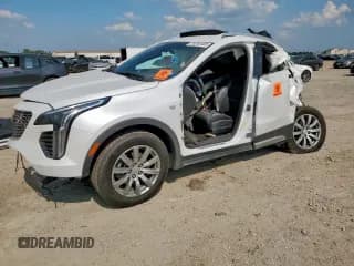 ✅ 2022 Cadillac XT4 FWD Premium Luxury • VIN: 1GYFZCR42NF112658 • Lot: 70282485. Listed on Copart with 100,630 mi. Free auction sales archive from the USA and detailed vehicle history report at DreamBid. Image 1.