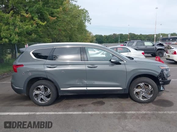 ✅ 2021 Hyundai Santa Fe SEL • VIN: 5NMS3DAJ9MH318767 • Lot: 43327611. Listed on IAAI with 82,332 mi. Free auction sales archive from the USA and detailed vehicle history report at DreamBid. Image 13.