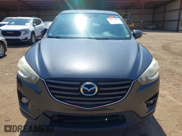 ✅ 2016 Mazda CX-5 Grand Touring • VIN: JM3KE2DYXG0769581 • Lot: 43174558. Listed on IAAI with 206,517 mi. Free auction sales archive from the USA and detailed vehicle history report at DreamBid. Image 6.