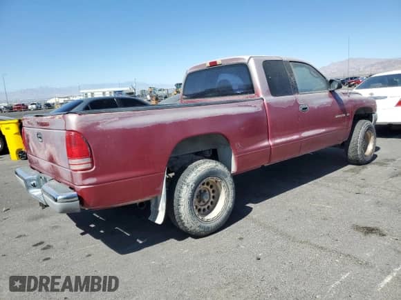 1999 Dodge Dakota SLT z VIN 1B7GG22X5XS215601, wystawiony jako Copart lot #80686715 z przebiegiem 273 332 mil mil oraz Czysty tytuł • Clean title. Historia ofert i sprzedaży dostępna na DreamBid. Obrazek 3.