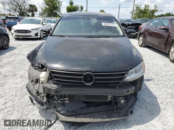 ✅ 2015 Volkswagen Jetta SE • VIN: 3VWD17AJ1FM238876 • Lot: 58957215. Listed on Copart with 122,705 mi. Free auction sales archive from the USA and detailed vehicle history report at DreamBid. Image 5.