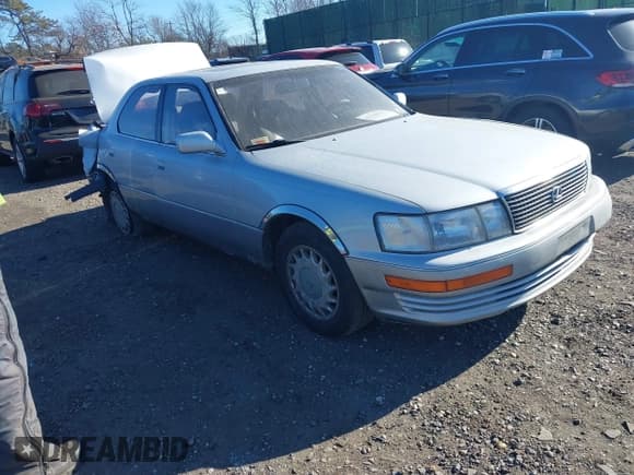 ✅ 1990 Lexus LS • VIN: JT8UF11E9L0025885 • Lot: 41330993. Listed on IAAI with 162,255 mi. Free auction sales archive from the USA and detailed vehicle history report at DreamBid. Image 1.
