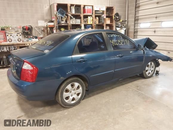 ✅ 2004 Kia Spectra LX • VIN: KNAFE121145012249 • Lot: 42032571. Listed on IAAI with 146,748 mi. Free auction sales archive from the USA and detailed vehicle history report at DreamBid. Image 4.