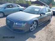 ✅ 2015 Audi A8 • VIN: WAUJGAFD0FN006762 • Lot: 42975851. Wystawiony na IAAI z przebiegiem 129 261 mil. Bezpłatny archiwum sprzedaży aukcyjnych z USA i szczegółowy raport historii pojazdu na DreamBid. Zdjęcie 2.