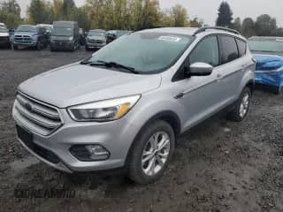 2018 Ford Escape SE с VIN 1FMCU9GD6JUA73829, выставлен на аукционе Copart как лот 90040835 с пробегом 84 854 миль миль и Чистый • Clean title. История ставок и продаж доступна на DreamBid. Изображение 1.