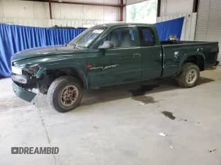 2000 Dodge Dakota Sport z VIN 1B7GG22NXYS658598, wystawiony jako Copart lot #66630015 z przebiegiem 142 502 mil mil oraz Szkoda całkowita • Salvage title. Historia ofert i sprzedaży dostępna na DreamBid. Obrazek 1.