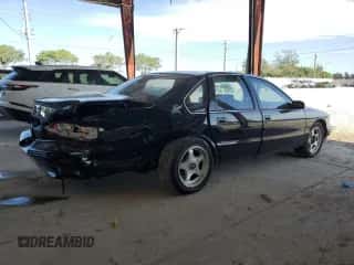 1996 Chevrolet Caprice 1SA Special Value z VIN 1G1BL52P2TR162969, wystawiony jako Copart lot #64120355 z przebiegiem 157 218 mil mil oraz Szkoda całkowita • Salvage title. Historia ofert i sprzedaży dostępna na DreamBid. Obrazek 3.