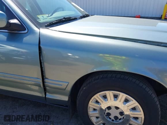 ✅ 2005 Ford Crown Victoria Standard • VIN: 2FAFP73W05X118255 • Lot: 42112937. Listed on IAAI with 71,481 mi. Free auction sales archive from the USA and detailed vehicle history report at DreamBid. Image 16.