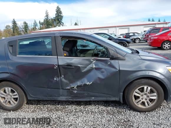 2013 Chevrolet Sonic LT with VIN 1G1JC6SG2D4148084, listed as a IAAI auction lot 43459236 with 94,963 mi miles and . Bid and sale history available at DreamBid. Image 6.