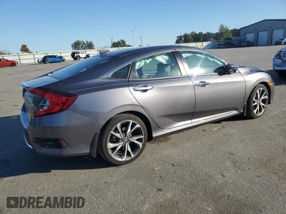 ✅ 2021 Honda Civic Touring • VIN: 19XFC1F95ME003941 • Lot: 89483625. Listed on Copart with 8,147 mi. Free auction sales archive from the USA and detailed vehicle history report at DreamBid. Image 3.