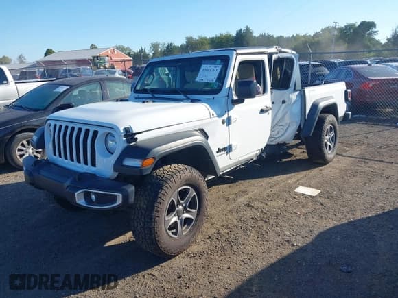 ✅ 2023 Jeep Gladiator Sport S • VIN: 1C6HJTAG8PL512098 • Лот: 43085793. Опубликован ранее на IAAI с пробегом 39 180 миль. Бесплатный доступ к архиву аукционных продаж из США и подробный отчёт об истории автомобиля на DreamBid. Изображение 2.