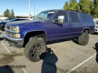 ✅ 1999 Chevrolet Suburban • VIN: 1GNEC16R9XJ307672 • Lot: 78663054. Listed on Copart with 198,081 mi. Free auction sales archive from the USA and detailed vehicle history report at DreamBid. Image 1.