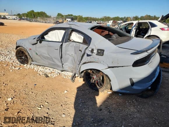 ✅ 2022 Dodge Charger Scat Pack Widebody • VIN: 2C3CDXGJXNH180412 • Лот: 82437145. Опубликован ранее на Copart с пробегом 26 998 миль. Бесплатный доступ к архиву аукционных продаж из США и подробный отчёт об истории автомобиля на DreamBid. Изображение 2.