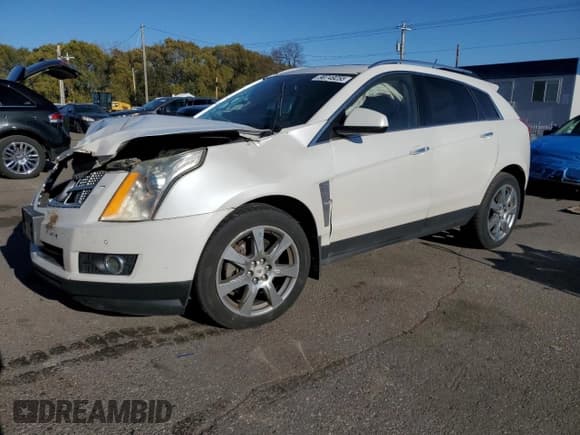 ✅ 2012 Cadillac SRX Performance Collection • VIN: 3GYFNBE3XCS620131 • Lot: 90749255. Listed on Copart with 172,653 mi. Free auction sales archive from the USA and detailed vehicle history report at DreamBid. Image 1.