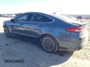 ✅ 2018 Ford Fusion Titanium • VIN: 3FA6P0D96JR234004 • Lot: 86815465. Wystawiony na Copart z przebiegiem 205 379 mil. Bezpłatny archiwum sprzedaży aukcyjnych z USA i szczegółowy raport historii pojazdu na DreamBid. Zdjęcie 2.