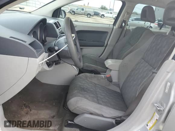 2007 Dodge Caliber z VIN 1B3HB28B57D183012, wystawiony jako Copart lot #40094824 z przebiegiem 266 458 mil mil oraz Nie do naprawy • Non repairable. Historia ofert i sprzedaży dostępna na DreamBid. Obrazek 7.