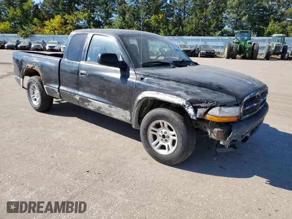2003 Dodge Dakota SLT z VIN 1D7HL42X33S284170, wystawiony jako Copart lot #76657204 z przebiegiem 146 790 mil mil oraz Szkoda całkowita • Salvage title. Historia ofert i sprzedaży dostępna na DreamBid. Obrazek 4.