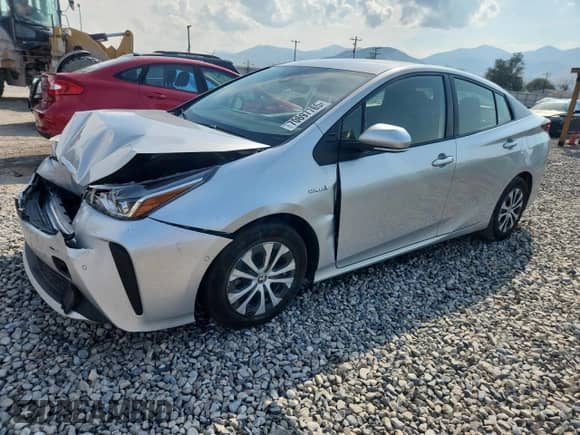 2021 Toyota Prius L Eco with VIN JTDKAMFU1M3150517, listed as a Copart auction lot 70697765 with 107,800 mi miles and Salvage title. Bid and sale history available at DreamBid. Image 1.