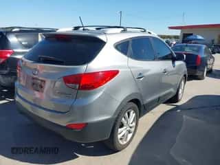 2012 Hyundai Tucson GLS with VIN KM8JU3AC9CU482947, listed as a IAAI auction lot 43502574 with 170,920 mi miles and . Bid and sale history available at DreamBid. Image 4.