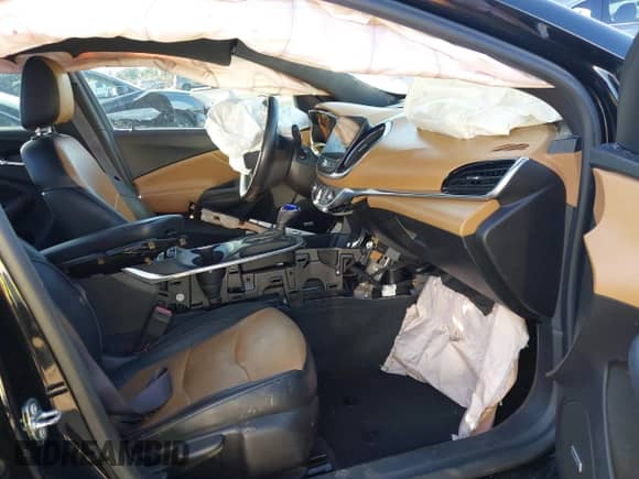 2017 Chevrolet Volt Premier z VIN 1G1RB6S5XHU203648, wystawiony jako IAAI lot #43468353 z przebiegiem Nie podano mil oraz . Historia ofert i sprzedaży dostępna na DreamBid. Obrazek 5.