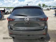 ✅ 2022 Mazda CX-5 2.5 Turbo • VIN: JM3KFBAY6N0607767 • Лот: 71276325. Опубликован ранее на Copart с пробегом 63 133 миль. Бесплатный доступ к архиву аукционных продаж из США и подробный отчёт об истории автомобиля на DreamBid. Изображение 6.