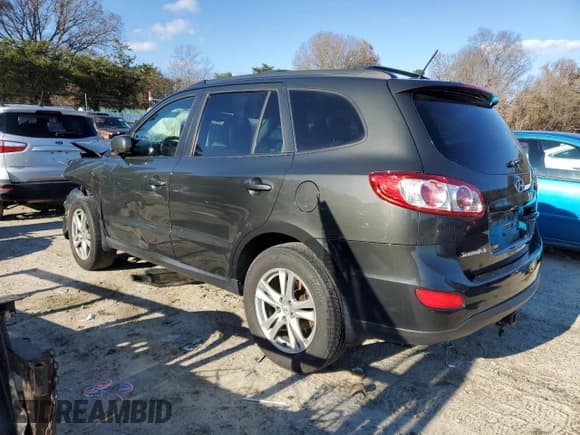 ✅ 2012 Hyundai Santa Fe Limited • VIN: 5XYZHDAG9CG159861 • Lot: 81720654. Listed on Copart with 188,181 mi. Free auction sales archive from the USA and detailed vehicle history report at DreamBid. Image 2.